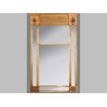 AN ANTIQUE GILT FRAMED PIER GLASS, the rectangular frame with a break-front top, lattice moulding