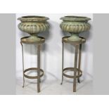 A PAIR OF LARGE GREEN PATINATED METAL JARDINIERS, in the antique Grecian manner, the rims