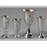 A COLLECTION OF FOUR RUSSIAN SILVER KIDDUSH CUPS, all similarly decorated with pin-prick engravings,