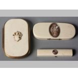 A COLLECTION OF THREE IVORY OBJECTS, comprising; a late Georgian ivory memento mori box, 9cm long, a