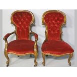 A PAIR OF VICTORIAN MAHOGANY SALON CHAIRS, one with armrests, the arched carved rails enclosing deep