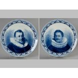 A LARGE PAIR OF DUTCH DELFT CHARGERS, painted in underglaze blue with portraits of Dutchmen in the