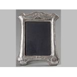 A SILVER PHOTOGRAPH FRAME, LONDON 1967, J.B. Ltd, the retangular frame embossed with flowers and