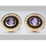 A PAIR OF 9ct YELLOW GOLD AND TANZANITE CUFFLINKS, oval centre tanzanite tube set, surrounded by