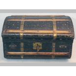 AN EARLY VICTORIAN COACHING CHEST, the oxidized black painted surface embellished with brass studs