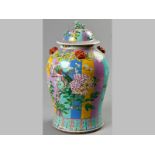 A LARGE CHINESE BALUSTER JAR AND COVER, the body decorated with a background of large vertical