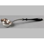 AN .800STD SILVER TODDY LADLE, with ebony handle and ivory finial, gilded bowl, 36cm long.