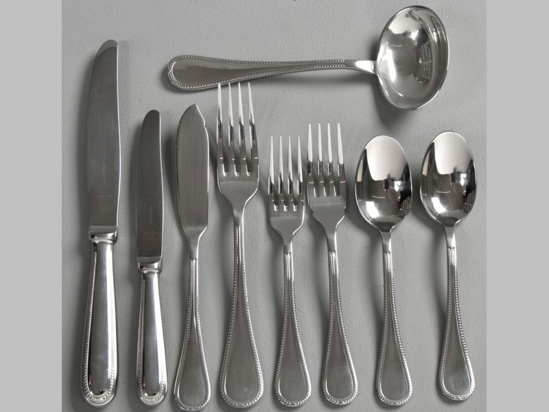 A TEN PLACE CHRISTOFLE CAPRICORNE "ODINE" PATTERN STAINLESS STEEL CUTLERY SET, comprising: 10 dinner