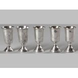 A COLLECTION OF FIVE RUSSIAN SILVER KIDDUSH CUPS, all similarly decorated with pin-prick engravings,