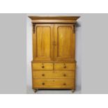 A VICTORIAN MAHOGANY LINEN PRESS, the moulded pediment above two arched panelled doors enclosing