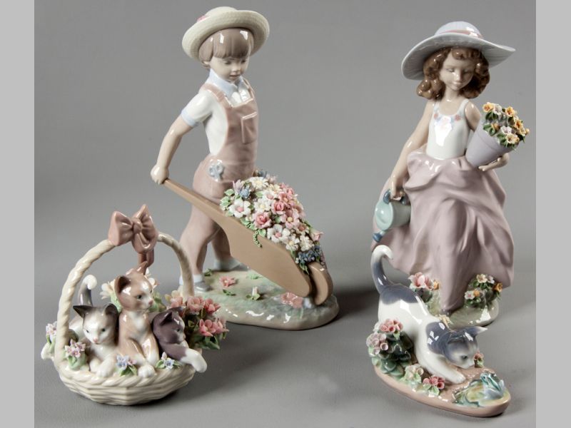 A COLLECTION OF LLADRO GARDENING FIGURES, comprising a young girl holding flowers and a watering