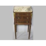AN EDWARDIAN MAHOGANY PEDESTAL CABINET, in the French manner, the moulded top with a marble