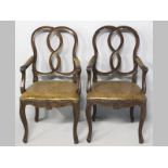 A PAIR OF MAHOGANY ARMCHAIRS, in the Mid-Georgian style of Mattthew Darley, the intertwined ribbon