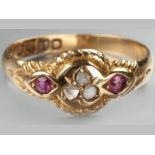 AN 18CT YELLOW GOLD, RUBY AND DIAMOND RING, centre set with three miner cut diamonds in clover form,