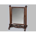 A VICTORIAN MAHOGANY DRESSING MIRROR, the rectangular framed flanked by a pair of octagonal tapering