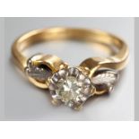 AN 18CT YELLOW GOLD AND DIAMOND RING, brilliant cut claw set diamond, scroll and leaf shoulders,