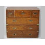 A VICTORIAN OAK MILITARY CHEST, in two sections, the upper-section with three short drawers above