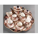 A CABARET SET OF ROYAL CROWN DERBY - CIRCA 1900, comprising a circular tray, teapot, sugar bowl,