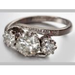 AN 18CT WHITE GOLD, PLATINUM AND DIAMOND RING, centre claw set brilliant cut diamond flanked by