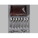 A DUTCH SILVER TEASPOON SET, comprising: seven teaspoons, a caddy spoon and a sugar spoon, presented