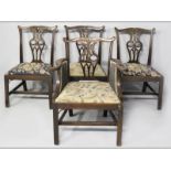 A SET OF FOUR 19TH CENTURY MAHOGANY DINING CHAIRS, in the Chippendale style, including one armchair,