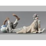 A LLADRÓ FIGURINE OF A RECLINING CLOWN, with a ball at his feet, base with printed factory mark,