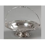 AN EDWARDIAN SILVER BASKET SHEFFIELD 1906, WILLIAM HUTTON & SONS LTD., swing-over handle, the rim