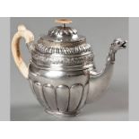 A MID-19TH CENTURY RUSSIAN SILVER TEAPOT, 1850, E.L., hinged cover with removable ivory finial, C-