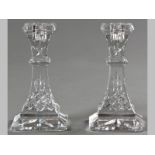 A PAIR OF WATERFORD CRYSTAL CANDLESTICKS, diamond pattern, tapering stem on a square raised base,