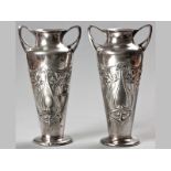 A PAIR OF WMF ART NOUVEAU VASES, fold-over rim, twin C-form handles, elongated body embossed with