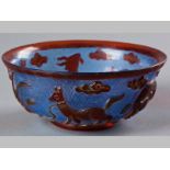 A CHINESE GLASS BOWL WITH ANIMALS FROM THE ZODIAC - 20TH CENTURY, in red glass overlaid onto a