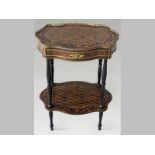 A CONTINENTAL BURR WALNUT PEDESTAL TABLE, the serpentine top inlaid with ebony and lattice stringing