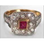 AN 18CT YELLOW GOLD, DIAMOND AND RUBY RING, centre square ruby surrrounded by twelve diamonds in a