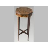 AN EDWARDIAN MULTI-WOOD LAMP STAND, the octagonal top inlaid with floral marquetry above a similarly