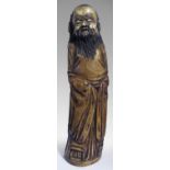 A STAINED IVORY FIGURE OF AN ELDERLY SAGE, 20TH CENTURY, 26cm high. NOT SUITABLE FOR EXPORT