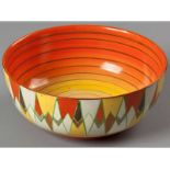 A CLARICE CLIFF "ORIGINAL BIZARRE" BOWL, triangles in shades of brown, orange and yellow, out-