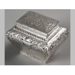 A VICTORIAN SILVER TEA CADDY SHEFFIELD 1896, MAKERS MARKS INDECIPHERABLE, hinged cover embossed with