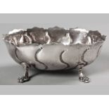 AN 18TH CENTURY IRISH SILVER SUGAR BASIN, MICHAEL KEATING, of oval form with a segmented wavy rim,