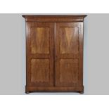 A 19TH CENTURY CONTINENTAL FLAME MAHOGANY WARDROBE, the moulded top with a bobbin stringing above