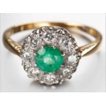 AN 18CT YELLOW GOLD, DIAMOND AND EMERALD RING, centre claw set round emerald surrounded by eight