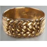 AN 18CT YELLOW GOLD RING, of woven form, 7.7g.