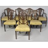 A SET OF EIGHT SHERATON-STYLE MAHOGANY DINING CHAIRS, including two carvers, the shield backs with