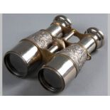 A PAIR OF EARLY 20TH CENTURY TELESCOPIC BINOCULARS, with brass banding and embossed with floral