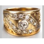 AN 18CT YELLOW GOLD AND DIAMOND RING, centre tube set diamond surrounded by ten pavé set diamonds,