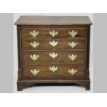 A MID-GEORGIAN MAHOGANY CHEST OF DRAWERS, the mitred top with a beaded edge above a brushing slide