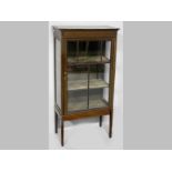 AN EDWARDIAN MAHOGANY DISPLAY CABINET, the rectangular top with boxwood stringing above a beaded