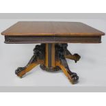 A VICTORIAN OAK AND EBONIZED SQUARE TABLE, the square top above a ribbon carved frieze, supported on