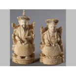 TWO CHINESE IVORY CARVINGS OF AN EMPEROR AND EMPRESS, EARLY 20TH CENTURY, both seated on horseshoe