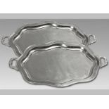 A PAIR OF MASSIVE 20TH CENTURY SILVERPLATE TRAYS, of rectangular form with a reeded serpentine