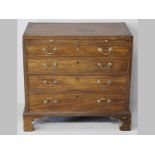 A GEORGE III MAHOGANY CHEST OF DRAWERS, the caddy top with cross-banding and stringing above a